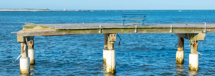 Remnants of the boardwalk with a bench in Atlantic City