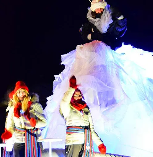 Queen of night parade greeting people