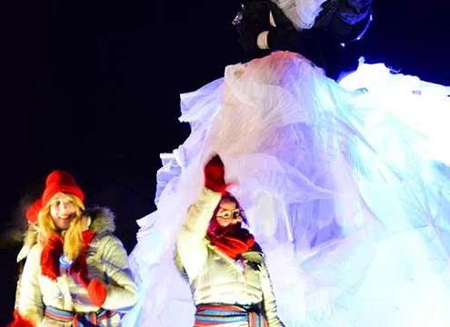 Queen of night parade greeting people