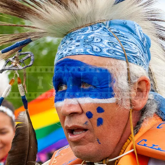 nice blue colors of face painting of a fancy dancer at pow wow