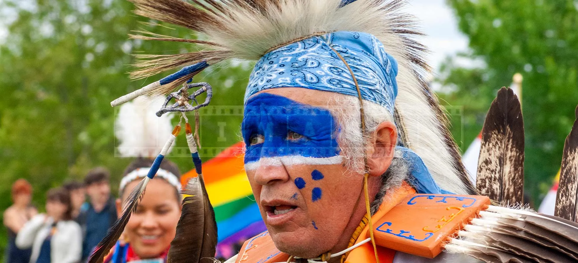 nice blue colors of face painting of a fancy dancer at pow wow