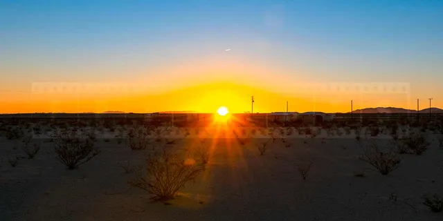 Sun rising above the horizon in the high desert of 29 Palms