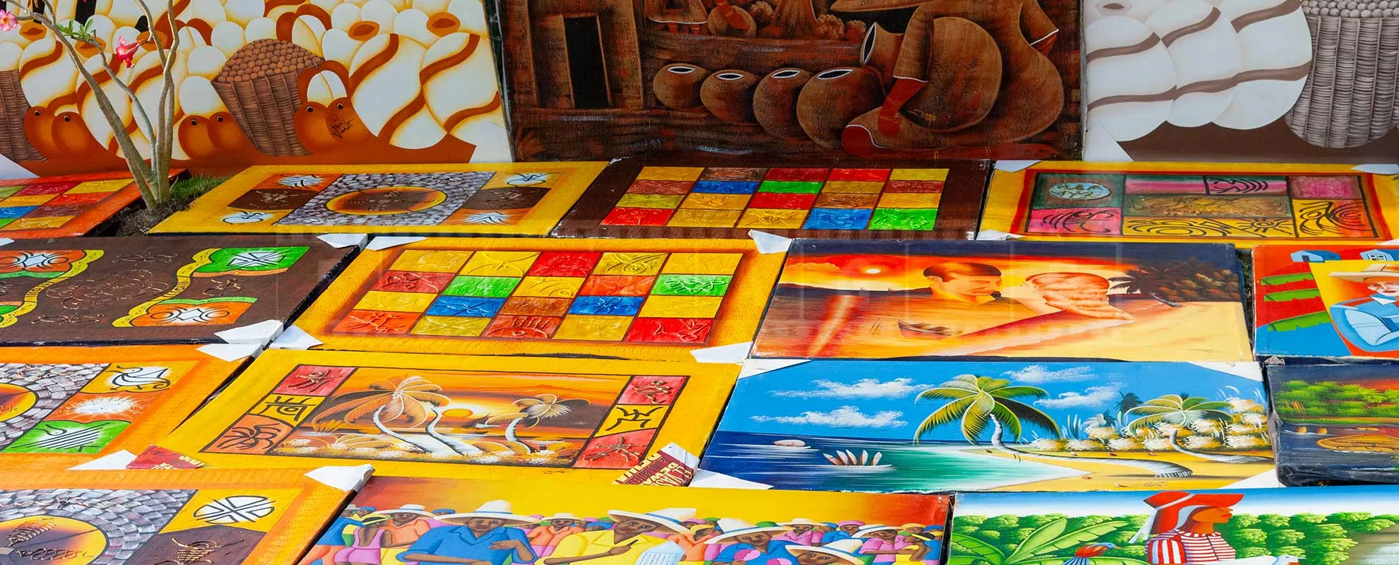 bright and colorful paintings at Dominican beach market