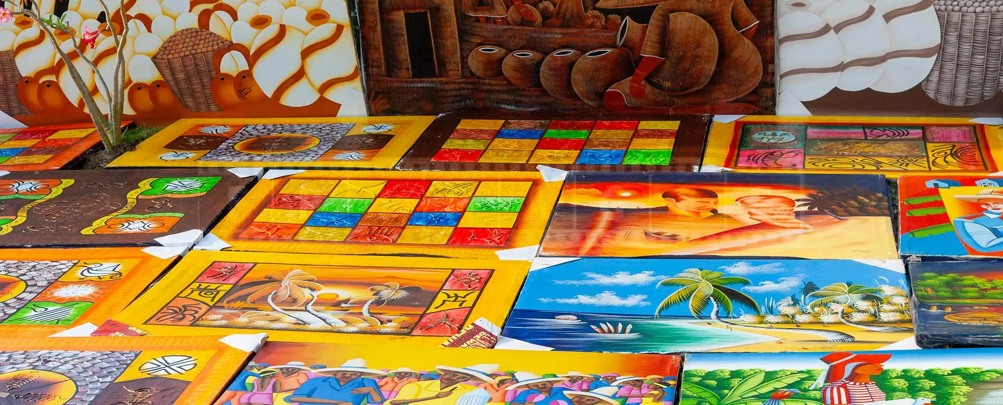 bright and colorful paintings at Dominican beach market