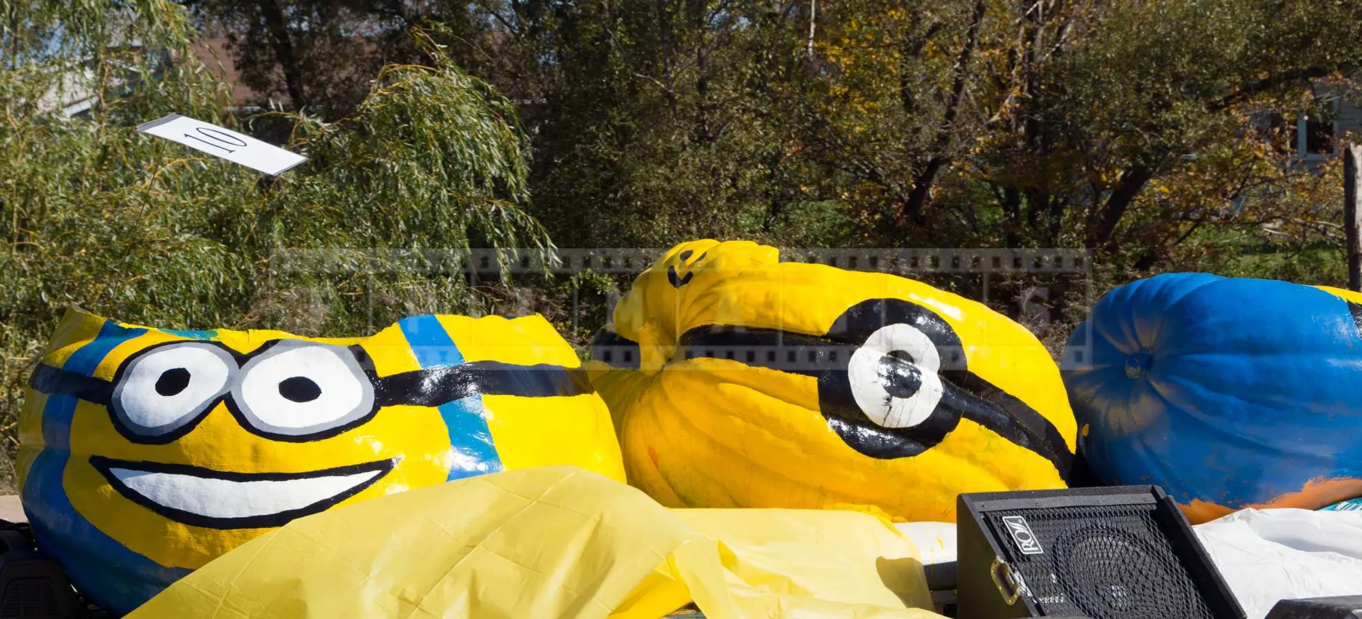 three large pumpkins made into floating boats on display during parade