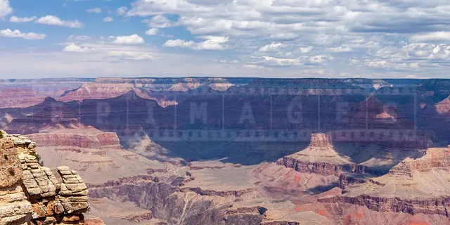 tourists at the lookout point over the Grand Canyon