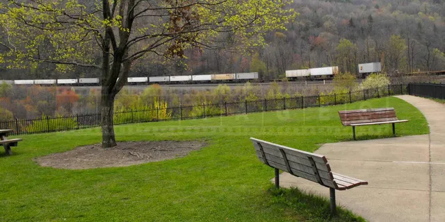 beautiful park with benches to observe trains