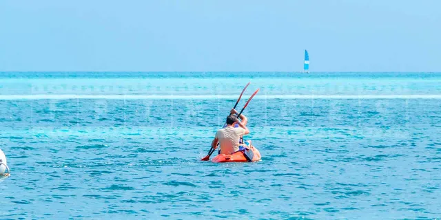 People enjoying kayak at Iberostar Daiquiri beach cuba