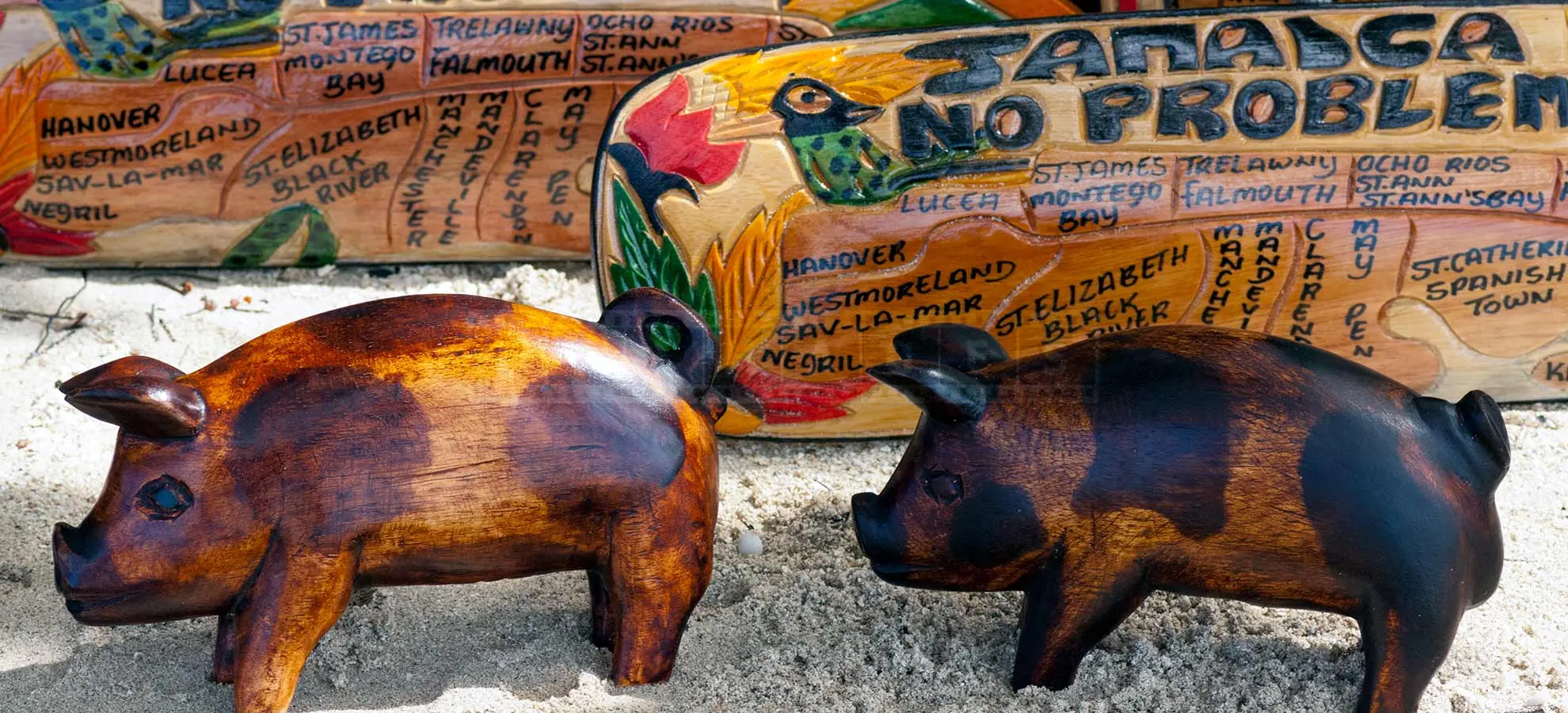 beachfront market with jamaican wood carvings