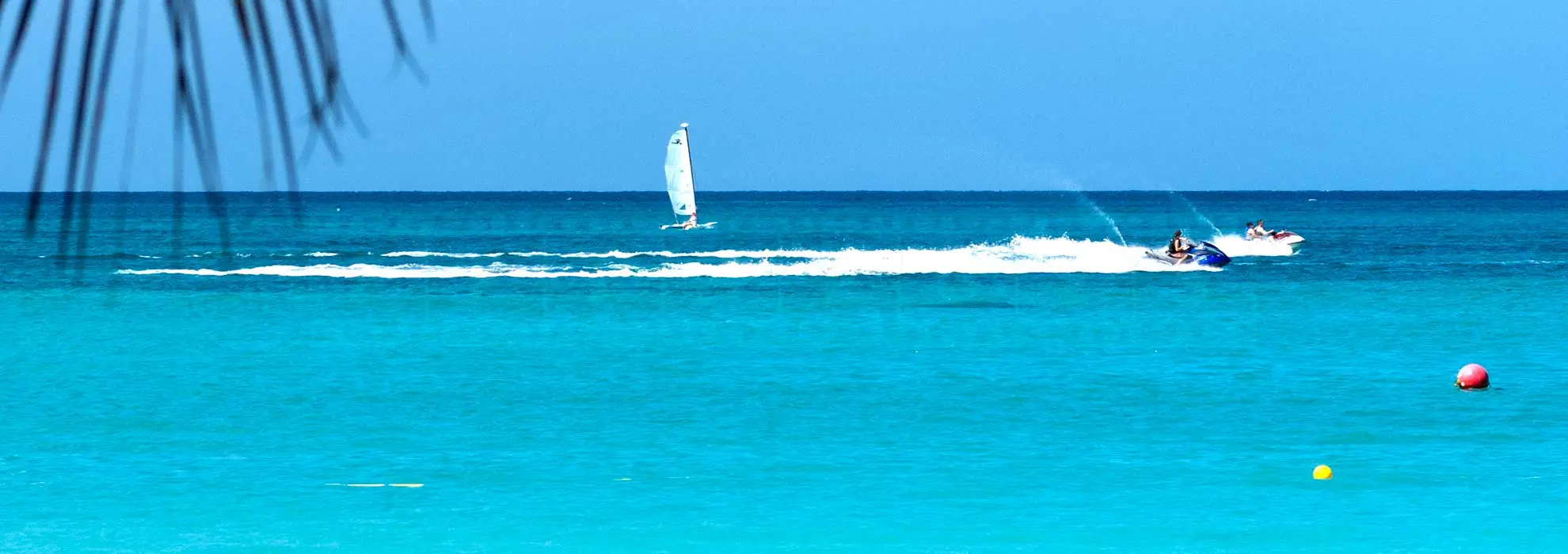 sailing boat, sea doo and motor boat active watersports in Jamaica