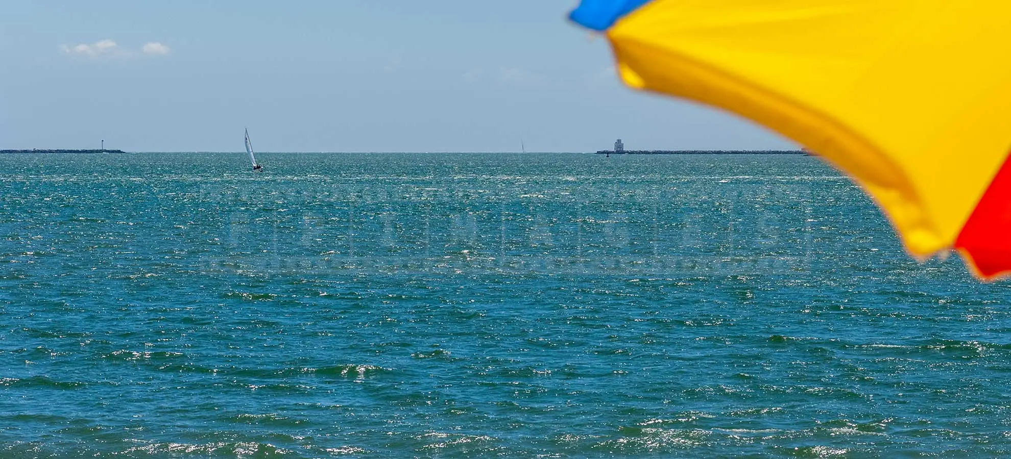sailing boat in long beach harbour as seen from Bixby Park