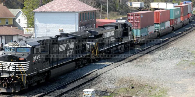 powerful train pulling a load of containers