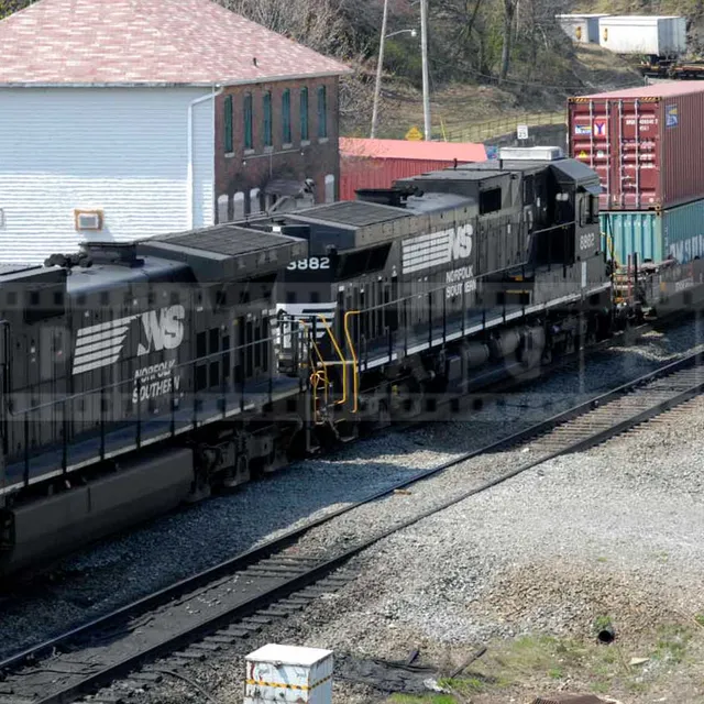 powerful train pulling a load of containers