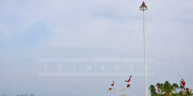 Papantla flyers performing their dance above the Malecon waterfront in Puerto Vallarta, Mexico