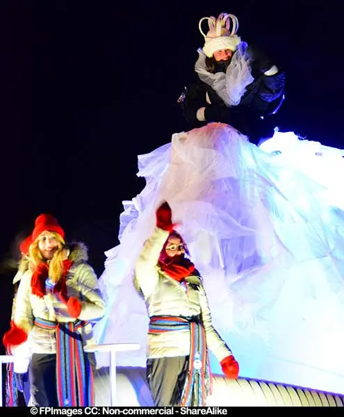 Queen of night parade greeting people