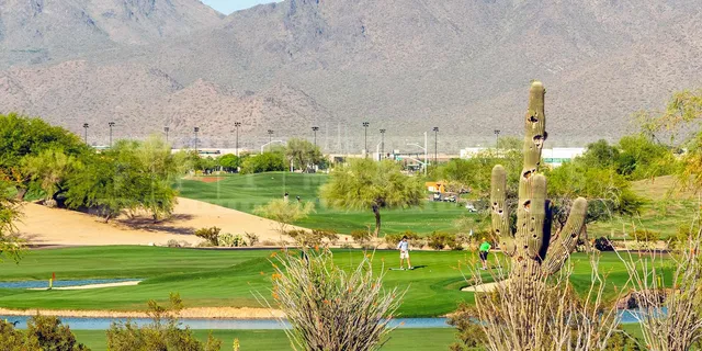 Scenic golf course picture with mountains