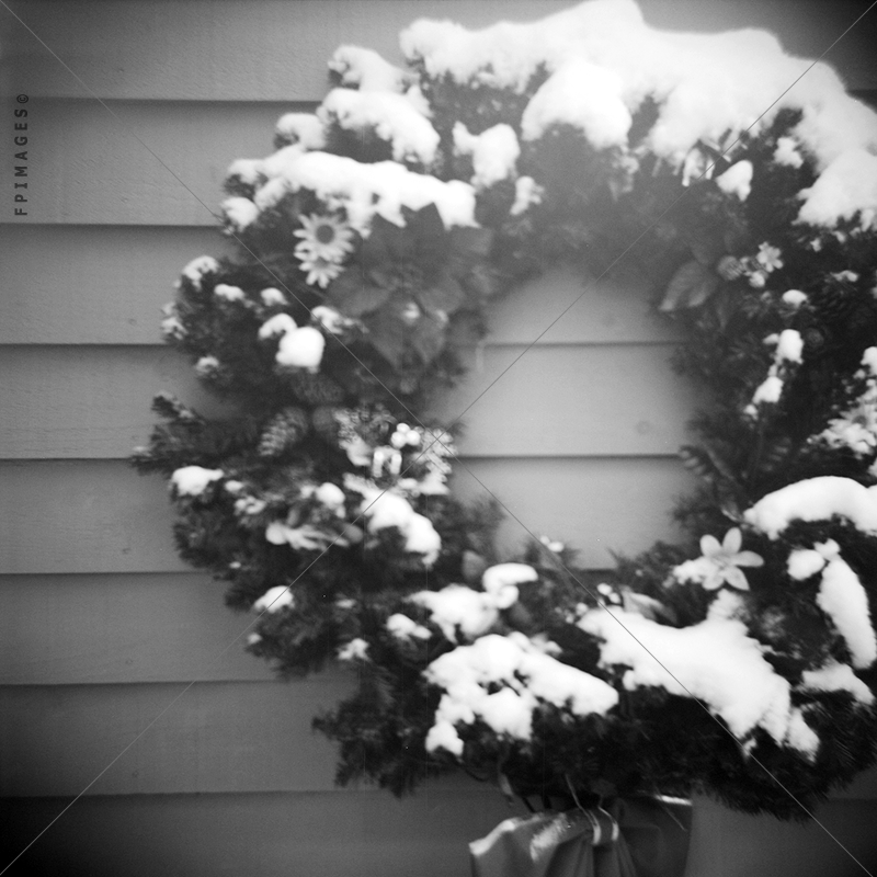 Snow covered christmas wreath B&W photo