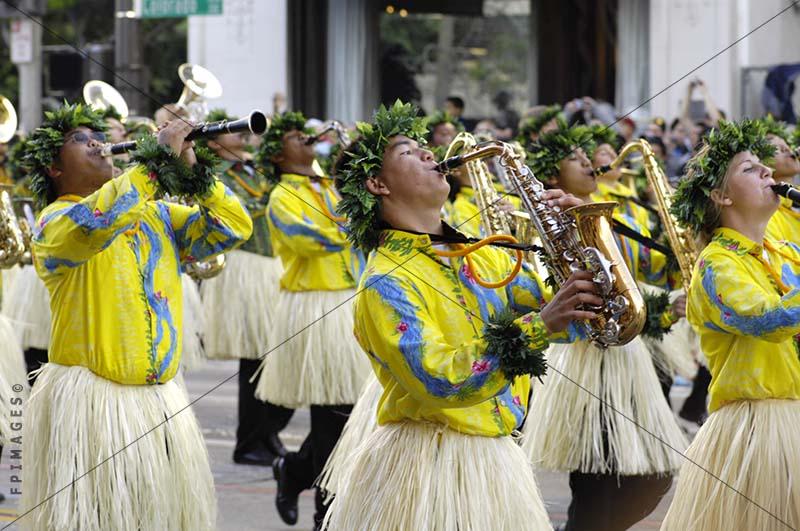 Brass Band marching in pau hula skirts, saxophone player