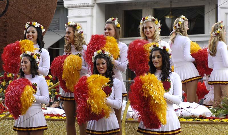 American football girls cheerleaders with red and yellow pom poms