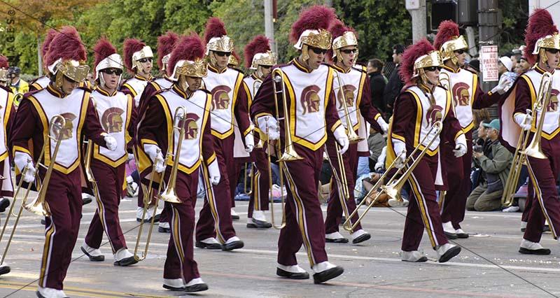 Street photo of marching Brass Band at Tournament of Roses Parade, USC Trojans