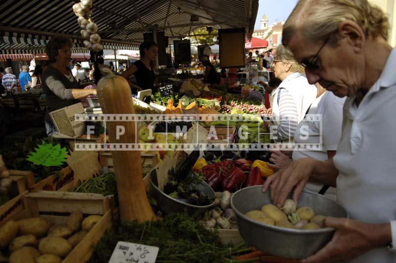 Old person picking out produce