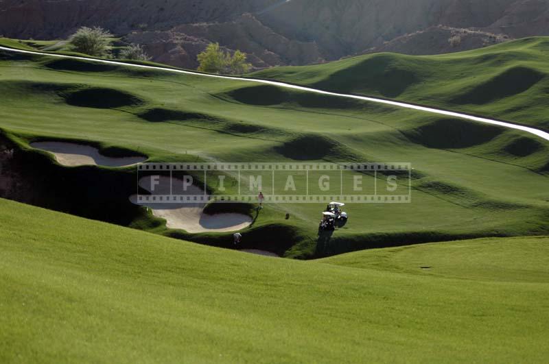 Player Looking for a Ball in a Deep Bunker, hole #14