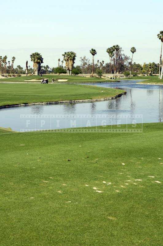 Clear Blue Lake Contrasting the Intense Green of the Course