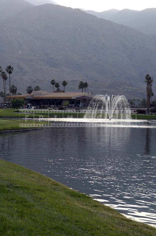 Final hole approaches and fountain on the lake