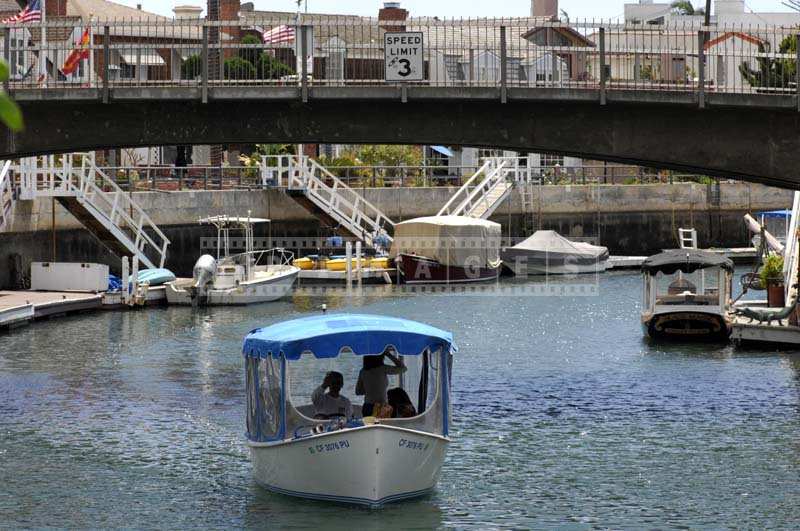 Boat Sailing Through the Canal in Naples