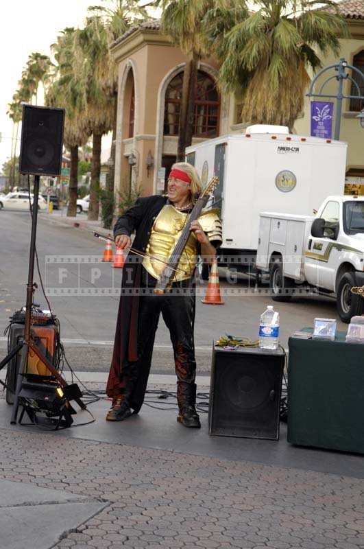 Thursday market - A Street Musician Filling the Air with Music