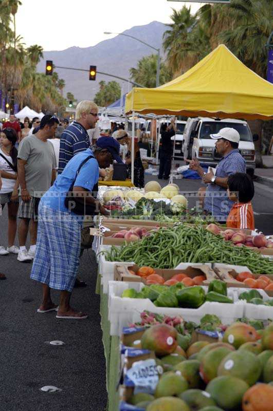 People picking fresh produce at the market