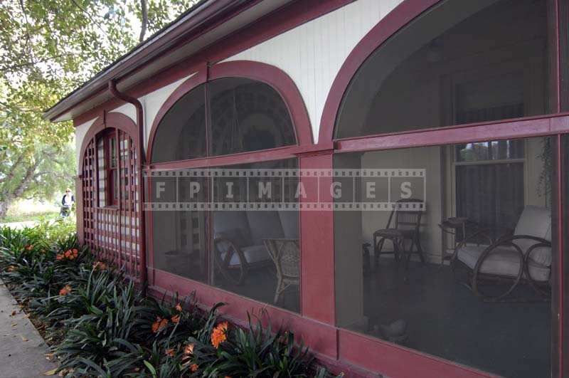 Red and white building and inviting veranda