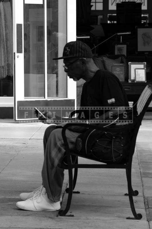 A Man Occupied with his Mobile Phone