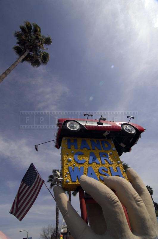 Hand Car Wash Sculpture with American Flag