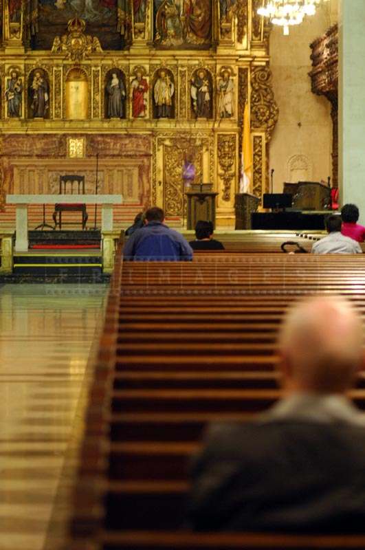 People Sitting on Benches in the Prayer Hall