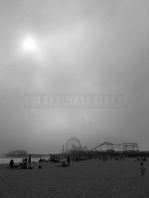 Beach and the pier on a foggy day