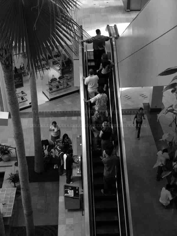 shopping mall escalator and people