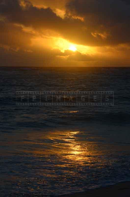 Dramatic golden sunrise at Bavaro beach