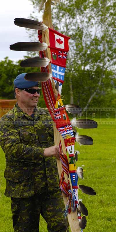 Soldier holds First Nations of Canada symbols