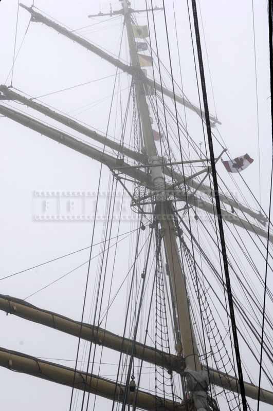 Flying Canadian flag on a foggy day