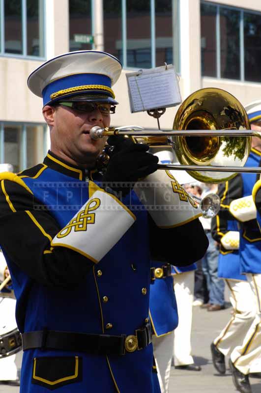 Trombone player in blue uniform