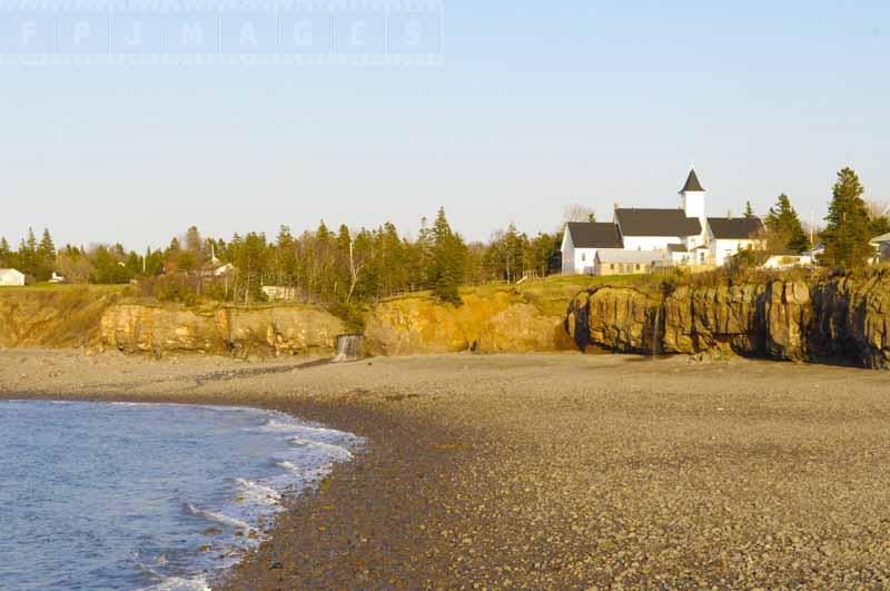 Stone beach coastline and large building