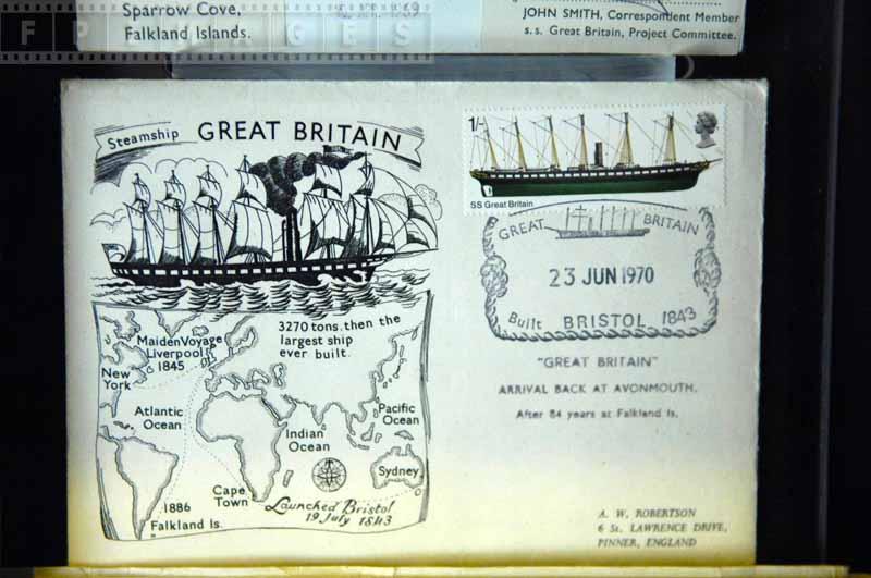 Royal mail stamp and map of voyages on the postcard