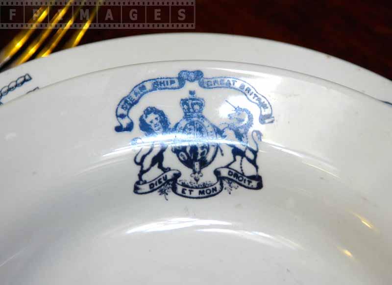 Blue crest on tableware