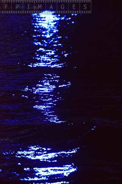 Ocean reflections of blue lights, abstract picture