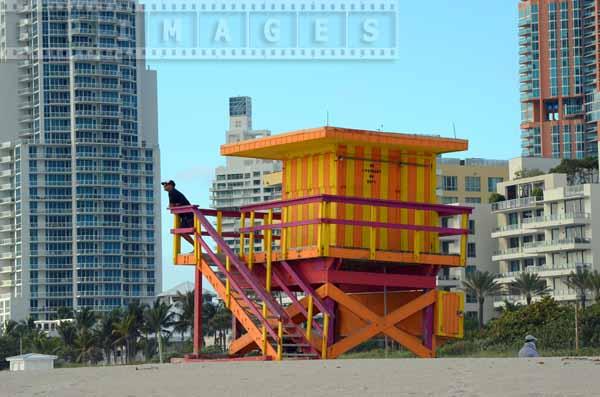 Person at the lifeguard tower, orange and yellow colors