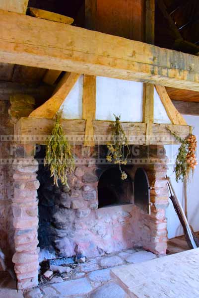 Stone bake oven and fireplace, interiors of Acadian house