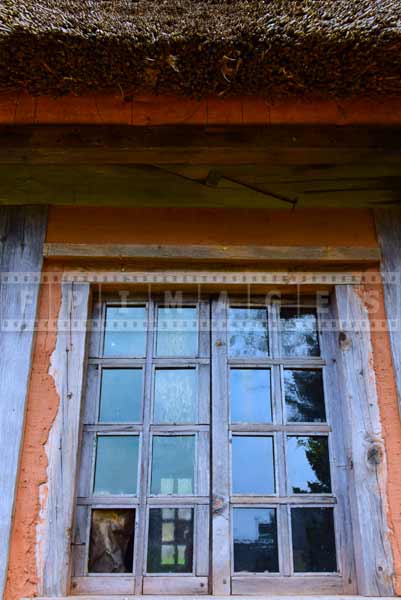 historic design of window and roof at Acadian house