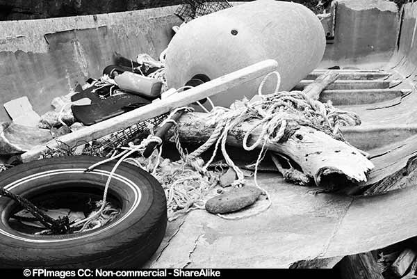 Junk inside the wreck of the fishing boat, black and white photo