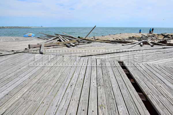 atlantic city boardwalk missing and ripped apart boards, urban decay